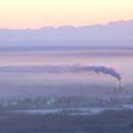 Downtown Fairbanks is blanketed in ice fog beneath the exhaust of a coal-fired power plant in January 2012. (Photo by Ned Rozell)