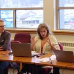 Lisa Pearce (center), a financial analyst for the Juneau School District, explains the deadline officials are facing to take action to resolve a massive deficit during a work session Saturday at Juneau-Douglas High School: Yadaa.at Kalé. Seated next to Pearce are Superintendent Frank Hauser (left) and school board member Britteny Cioni-Haywood. (Mark Sabbatini / Juneau Empire)