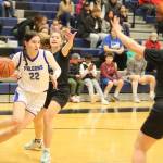 Thunder Mountain High Schools Kerra Baxter (#22) tries to penetrate Colony High Schools defense during Saturdays game at TMHS. (Mark Sabbatini / Juneau Empire)
