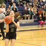 Thunder Mountain High Schools Cailynn Baxter (#23) tries to spook Colony High Schools Bella Shelley as she attempts a breakaway shot during Saturdays game at TMHS. (Mark Sabbatini / Juneau Empire)