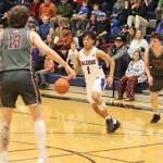 Thunder Mountain High Schools Lance Nierra looks for space inside during Saturdays game against Ketchikan High School on Saturday at TMHS. (Mark Sabbatini / Juneau Empire)