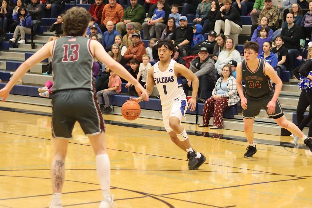 Thunder Mountain High Schools Lance Nierra looks for space inside during Saturdays game against Ketchikan High School on Saturday at TMHS. (Mark Sabbatini / Juneau Empire)