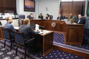 Andy Mills (left), legislative liaison for the state Department of Transportation and Public Facilities, and Commissioner Ryan Anderson testify before the Senate Transportation Committee on Tuesday about an executive order that would give the governor full control of the Alaska Marine Highway Systems operations board. (Mark Sabbatini / Juneau Empire)