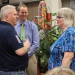 Juneau Mayor Beth Weldon (right) discusses the Juneau School Districts financial crisis with school board Vice President Emil Mackey (right) and City Attorney Robert Palmer during a meeting Thursday night at Juneau-Douglas High School: Yadaa.at Kalé. (Mark Sabbatini / Juneau Empire)
