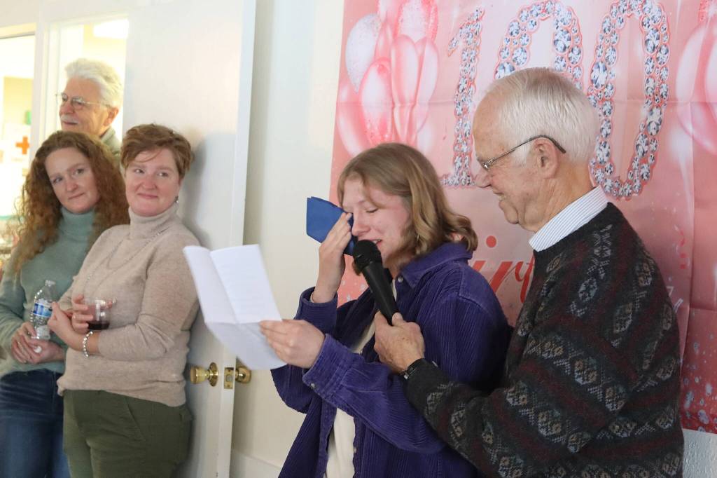 Taylor Bentley, 20, wipes away tears as she reads a speech to her great-grandmother, Jirdes Winther Baxter, during her 100th birthday celebration at the Juneau Yacht Club on Saturday. (Mark Sabbatini / Juneau Empire)