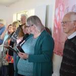 Juneau Mayor Beth Weldon reads a citation from the Juneau Assembly honoring Jirdes Winther Baxter during her 100th birthday celebration at the Juneau Yacht Club on Saturday. (Mark Sabbatini / Juneau Empire)