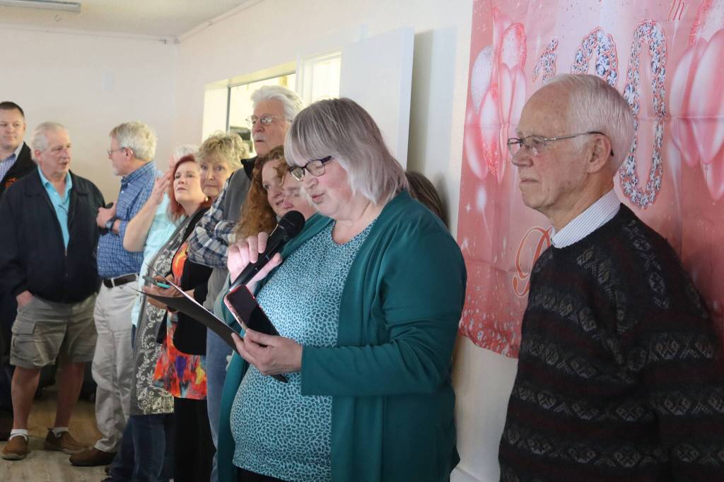 Juneau Mayor Beth Weldon reads a citation from the Juneau Assembly honoring Jirdes Winther Baxter during her 100th birthday celebration at the Juneau Yacht Club on Saturday. (Mark Sabbatini / Juneau Empire)