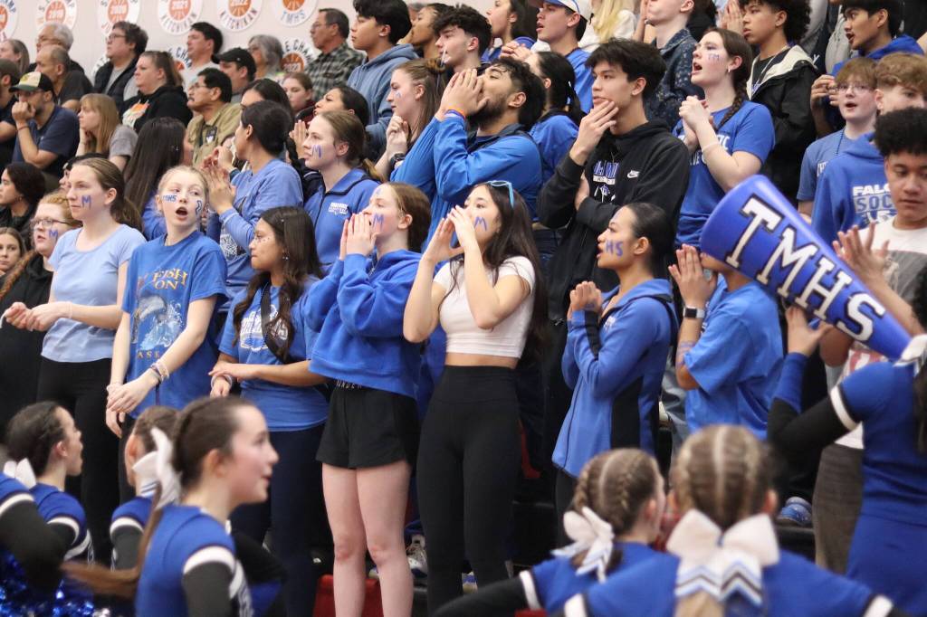 Thunder Mountain High School students and other supporters cheer for the Falcons during Saturdays game against Juneau-Douglas High School: Yadaa.at Kalé at JDHS. (Mark Sabbatini / Juneau Empire)
