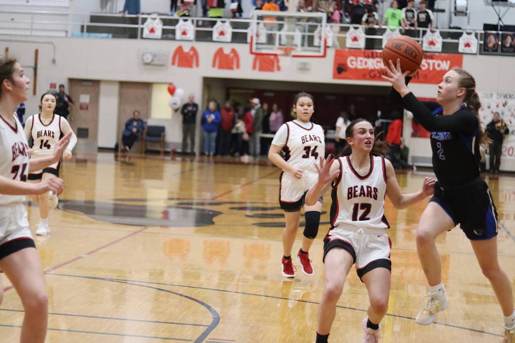 Thunder Mountain High Schools Ashlyn Gates takes a running jump shot against Juneau-Douglas High School: Yadaa.at Kalé at JDHS. (Mark Sabbatini / Juneau Empire)