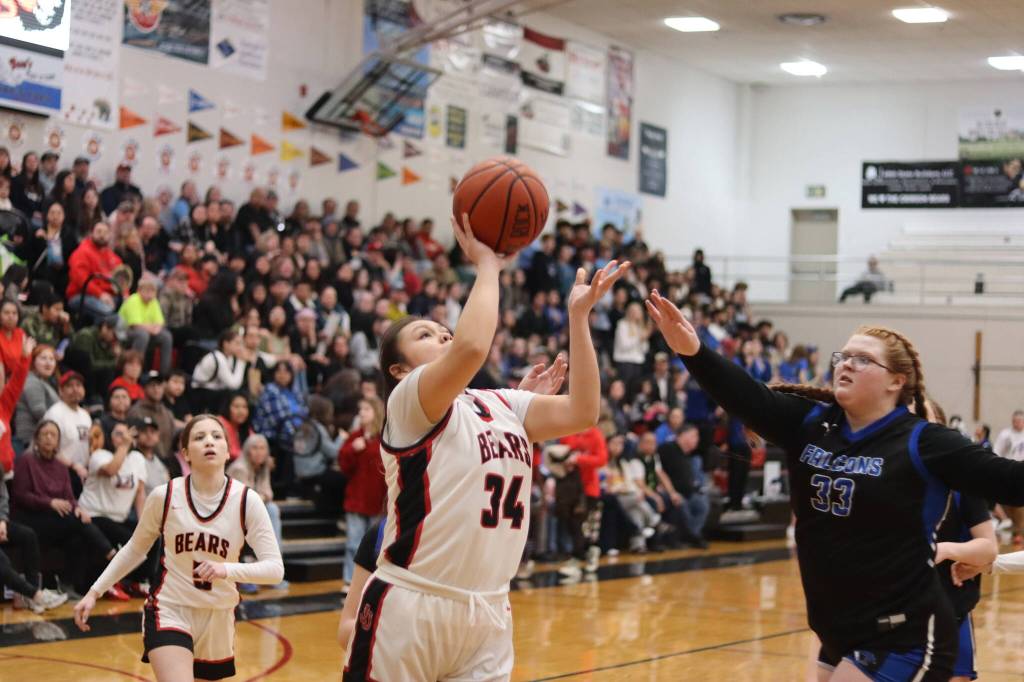 Juneau-Douglas High School: Yadaa.at Kalés Brenda William-See takes a shot against Thunder Mountain High Schools Kara Strong during Saturdays game at TMHS. (Mark Sabbatini / Juneau Empire)