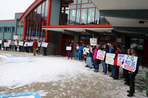 Students, parents and teachers rally outside Juneau-Douglas High School: Yadaa.at Kalé prior to a school board meeting Tuesday, seeking a change in the boards decision to consolidate Juneaus two high schools beginning with the next school year. (Mark Sabbatini / Juneau Empire)