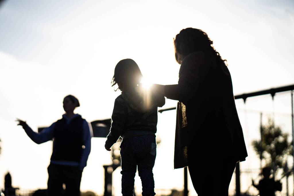 The author, Alana Peterson Gah Kith Tin walks her son on a playground in Sitka. (Photo by Bethany Goodrich)