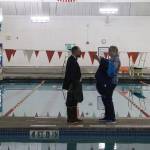 State Sen. Jesse Kiehl and Juneau Mayor Beth Wendon have a poolside chat during Fridays ribbon-cutting ceremony at the renovated Augustus G. Brown Swimming Pool. (Mark Sabbatini / Juneau Empire)