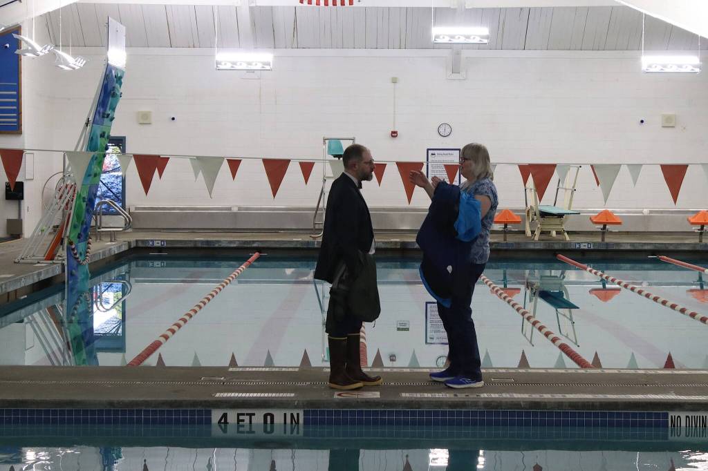 State Sen. Jesse Kiehl and Juneau Mayor Beth Wendon have a poolside chat during Fridays ribbon-cutting ceremony at the renovated Augustus G. Brown Swimming Pool. (Mark Sabbatini / Juneau Empire)