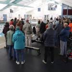 More than 50 people gather at the side of the main pool during Fridays ceremonial opening of the Augustus G. Brown Swimming Pool. (Mark Sabbatini / Juneau Empire)