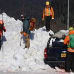 Emergency response officials probe the wreckage of a simulated avalanche site during a training exercise in Lemon Creek on Saturday. (Mark Sabbatini / Juneau Empire)