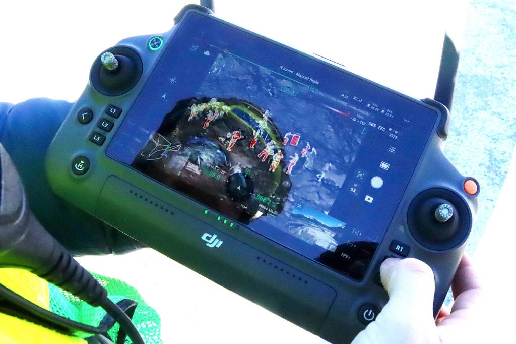The controller for a heat-signature drone shows red forms representing people in a simulated avalanche zone during a rescue exercise Saturday. (Mark Sabbatini / Juneau Empire)