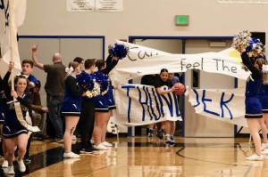 The Thunder Mountain High School Falcons girls basketball team comes onto the floor Saturday. (Klas Stolpe / For the Juneau Empire)