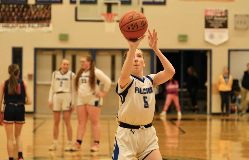 Thunder Mountain High School senior Jenna Dobson (5) hits the final home court point for the Falcons on Saturday in their 36-31 win over North Pole. (Klas Stolpe / For the Juneau Empire)