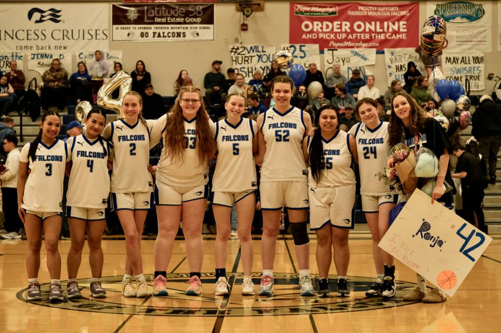 Thunder Mountain High School senior girls basketball players were honored on Saturday. They are, from left, Jaya Carandang (3), Mikah Carandang (4), Ashlyn Gates (2), Kara Strong (33), Jenna Dobson (5), Olivia Mills (52), Makaley Johnson (55), Kaidree Hartman (24) and Ronja Sieber (42). (Klas Stolpe / For the Juneau Empire)