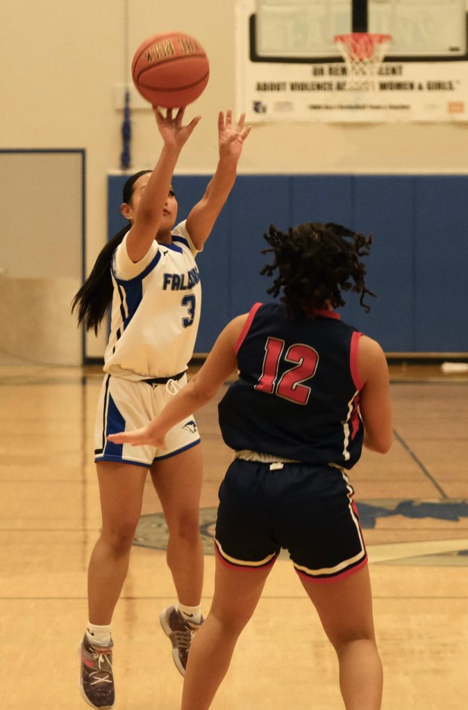 Thunder Mountain High Schools Jaya Carandang shoots over North Poles Jade Skipps. (Klas Stolpe / For the Juneau Empire)
