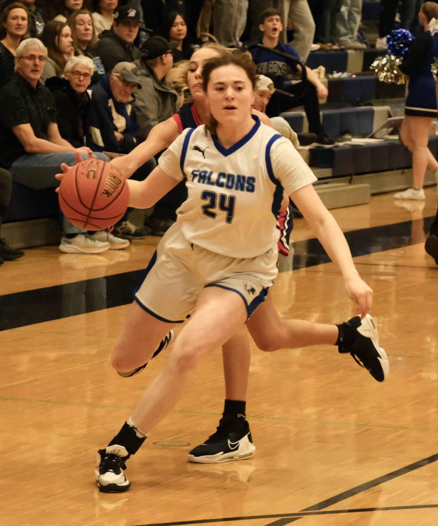 Thunder Mountain High School senior Kaidree Hartman gets past North Poles Tiahna Guzman. (Klas Stolpe / For the Juneau Empire)