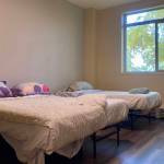 Freshly made beds are seen in an unoccupied room at the Fairbanks emergency shelter, Interior Alaska center for Non-Violent Living on Oct. 14, 2023. (Claire Stremple/Alaska Beacon)