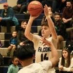 Thunder Mountain High School senior Samuel Lockhart (14) shoots a 3-pointer during a Feb. 1 game at TMHS. (Klas Stolpe / Juneau Empire file photo)