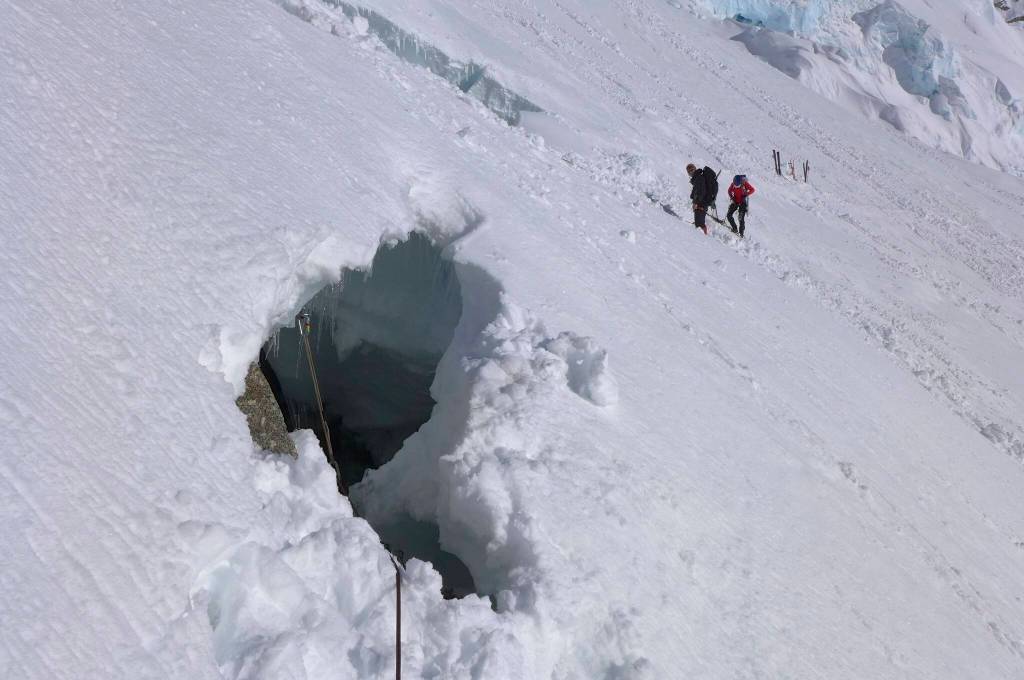 Peter Haeussler emerged from this hole in the Kahiltna Glacier after falling into a crevasse during a rock-gathering mission in 2014. (Photo by Peter Haeussler)