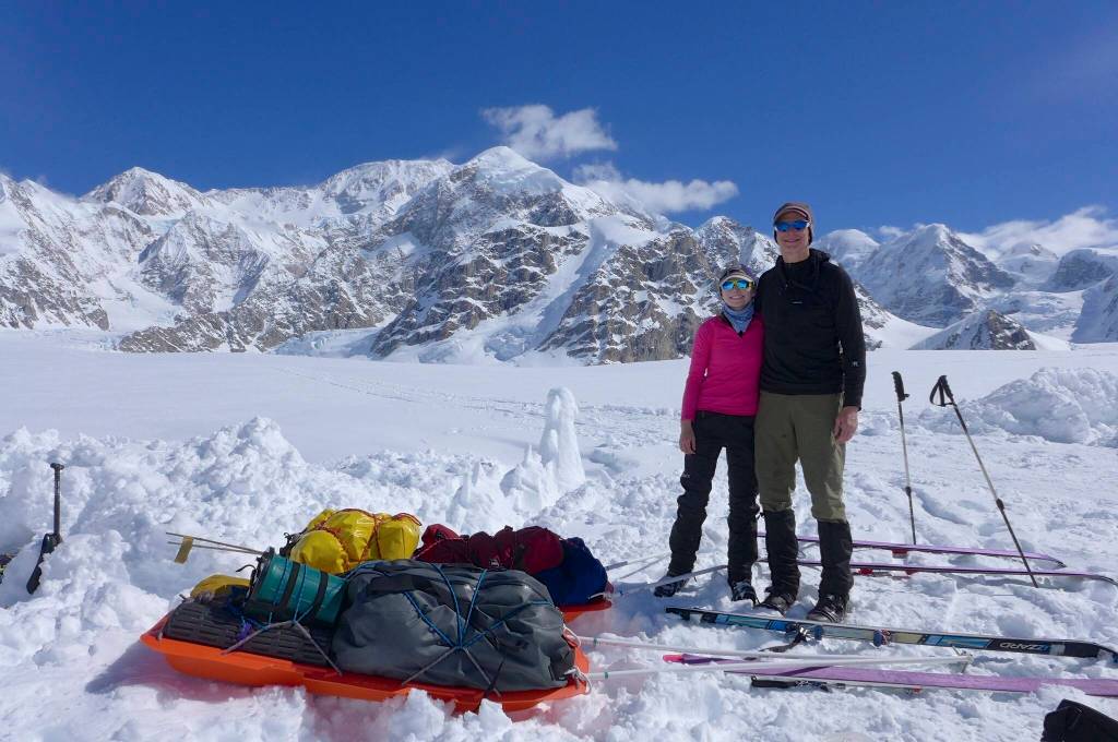 Kara Haeussler and her father Peter pose in front of the Kahiltna Peaks and Denali on June 3, 2014, at the conclusion of a trip during which they climbed mountains and collected rock samples. (Photo courtesy of Peter Haeussler)
