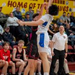 Thunder Mountain senior TJ Guevarra blocks a shot by Juneau-Douglas High School: Yadaa.at Kalé sophomore Brandon Casperson during the Falcons 63-58 win over the Crimson Bears in the championship game of the Alaska Airlines Region V 4A Basketball Tournament on Friday at Mt. Edgecumbe High Schools B.J. McGillis Gymnasium in Sitka. (James Poulson/Daily Sitka Sentinel)