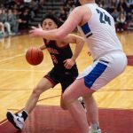 Juneau-Douglas High School: Yadaa.at Kalé senior Alwen Carrillo (3) drives against Thunder Mountain senior James Polasky (24) during the boys championship game of the Alaska Airlines Region V 4A Basketball Tournament on Friday at Mt. Edgecumbe High Schools B.J. McGillis Gymnasium in Sitka. (James Poulson/Daily Sitka Sentinel)