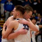Thunder Mountain seniors Thomas Baxter and James Polasky hug after the Falcons defeated the Juneau-Douglas High School: Yadaa.at Kalé Crimson Bears 63-58 in the championship game of the Alaska Airlines Region V 4A Basketball Tournament on Friday at Mt. Edgecumbe High Schools B.J. McGillis Gymnasium in Sitka. (James Poulson/Daily Sitka Sentinel)