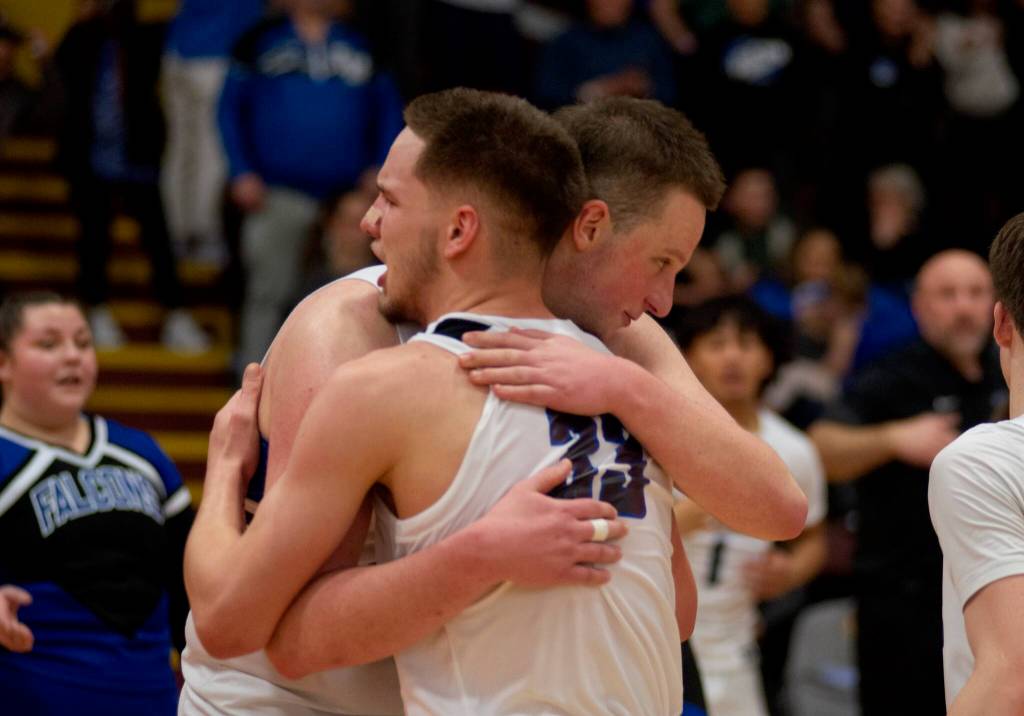 Thunder Mountain seniors Thomas Baxter and James Polasky hug after the Falcons defeated the Juneau-Douglas High School: Yadaa.at Kalé Crimson Bears 63-58 in the championship game of the Alaska Airlines Region V 4A Basketball Tournament on Friday at Mt. Edgecumbe High Schools B.J. McGillis Gymnasium in Sitka. (James Poulson/Daily Sitka Sentinel)