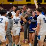 The Thunder Mountain High School Falcons boys basketball team celebrate their 63-58 win over the Juneau-Douglas High School: Yadaa.at Kalé Crimson Bears in the championship game of the Alaska Airlines Region V 4A Basketball Tournament on Friday at Mt. Edgecumbe High Schools B.J. McGillis Gymnasium in Sitka. (James Poulson/Daily Sitka Sentinel)