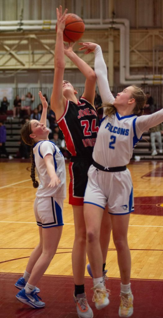 Thunder Mountain High School sophomore Cambry Lockhart and senior Ashlyn Gates (2) defend Juneau-Douglas High School: Yadaa.at Kalé senior Mila Hargrave (24) during the Falcons 56-49 win over the Crimson Bears in the championship game of the Alaska Airlines Region V 4A Basketball Tournament on Friday at Mt. Edgecumbe High Schools B.J. McGillis Gymnasium in Sitka. (James Poulson/Daily Sitka Sentinel)