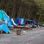 An assortment of furniture, clothing and other household items are exposed to the elements at Mill Campground after being left behind by residents who departed ahead of the campgrounds closing last October. (Mark Sabbatini / Juneau Empire file photo)
