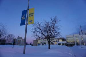 Sunset hues color the sky and the snow at the University of Alaska Fairbanks campus on Feb. 26. Enrollment in the University of Alaska system is growing, as are research programs, notably the Arctic-focused programs for which UAF is famous, said University of Alaska President Pat Pitney. (Yereth Rosen/Alaska Beacon)