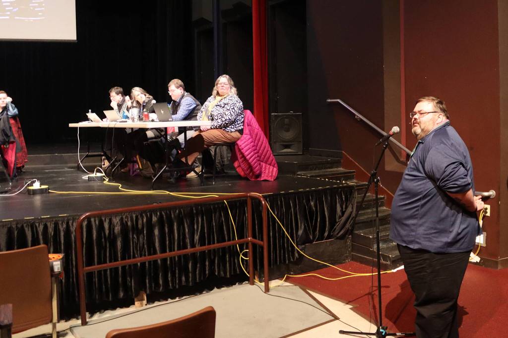 Richard Chalyee Éesh Peterson, president of The Central Council of the Tlingit and Haida Indian Tribes of Alaska testifies in favor of keeping two local high schools open for students in grades 8-12 during a Juneau Board of Education meeting Tuesday at Juneau-Douglas High School: Yadaa.at Kalé. (Mark Sabbatini / Juneau Empire)