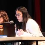 Amber Frommherz, a Juneau Board of Education member, presents her proposal for two local schools for students in grades 8-12 during a meeting Tuesday evening at Juneau-Douglas High School: Yadaa.at Kalé. (Mark Sabbatini / Juneau Empire)