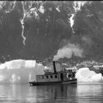 Icebergs from Taku Glacier frequently floated into Juneaus harbor in the early days and well into the 1970s. They needed to be towed away promptly lest they get pushed by storms and destroy the fragile pilings that supported downtown waterfront structures. (ASL-P226-239)