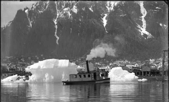 Icebergs from Taku Glacier frequently floated into Juneaus harbor in the early days and well into the 1970s. They needed to be towed away promptly lest they get pushed by storms and destroy the fragile pilings that supported downtown waterfront structures. (ASL-P226-239)