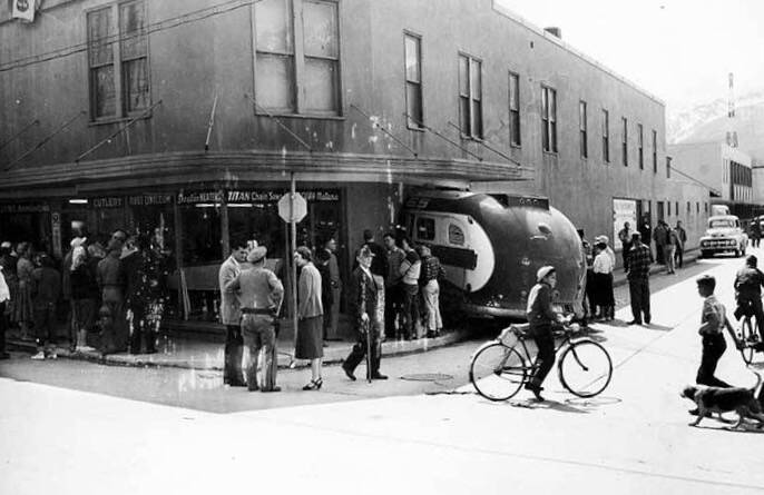By 1956, stucco covered the hardware store exterior. That summer a Channel Bus Lines vehicle lost control and crashed into the side of the building. (ASL-P533-1-1)