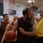 Hoonahs Mark Prpich (22) drives the lane against Juneaus Doug Draowski (5) on Saturday during last years Gold Medal championship game for M bracket at Juneau-Douglas High School: Yadaa.at Kalé on March 25, 2023. Prpich finished the game with 10 points. (Ben Hohenstatt / Juneau Empire)