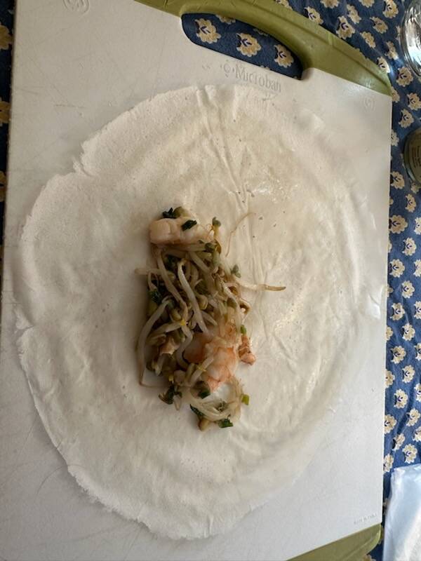 Filling a spring roll in preparation for frying. (Photo by Patty Schied)
Filling a spring roll in preparation for frying. (Photo by Patty Schied)