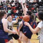 Metlakatlas Drena Hayward (#15) passes the ball to a teammate in their opening game against Yakutat during the 75th Gold Medal Basketball Tournament on Sunday morning at Juneau-Douglas High School: Yadaa.at Kalé. (Mark Sabbatini / Juneau Empire)