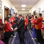 State Sen. Jesse Kiehl, a Juneau Democrat, greets educators and other people rallying in a hallway of the Alaska State Capitol just before the Legislatures override vote on Senate Bill 140 on Monday. (Mark Sabbatini / Juneau Empire)