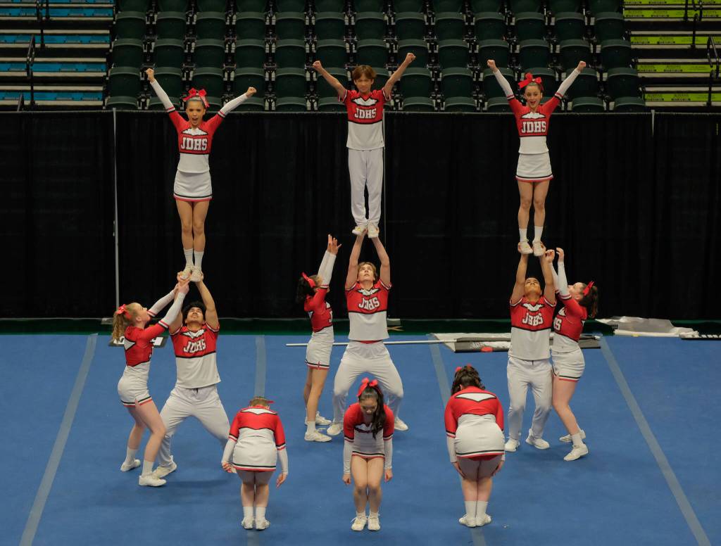 The Juneau-Douglas High School: Yadaa.at Kalé Crimson Bears cheer team at the 2024 ASAA/First National Bank Alaska Cheer State Championships at the Alaska Airlines Center in Anchorage. (Klas Stolpe, For the Juneau Empire)