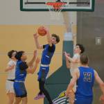 Thunder Mountain senior Kasen Ludeman secures a rebound against West Valley as teammates TJ Guevarra, Joren Gasga, Thomas Baxter and Samuel Lockhart look on during the Falcons 53-51 overtime win against the Wolfpack in the 2024 ASAA March Madness Alaska 4A Boys Basketball State Championships on Wednesday at Anchorages Alaska Airlines Center. (Klas Stolpe for the Juneau Empire)