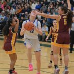 Thunder Mountain junior Kerra Baxter (22) is fouled by Dimond senior Maile Wilcox (5) during the Falcons 58-47 win over the Lynx in the 2024 ASAA March Madness Alaska 4A Girls Basketball State Championships on Wednesday at Anchorages Alaska Airlines Center. (Klas Stolpe / For the Juneau Empire)